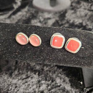 2 pair Silver tone outlined earrings with pink center